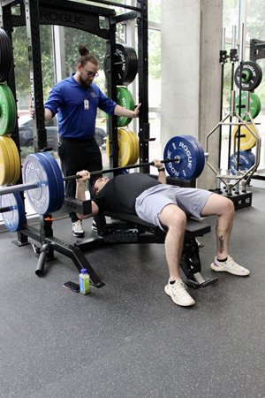 Man bench pressing a barbell