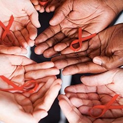 Hands Holding AIDS Ribbons